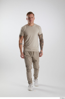 Gilbert 1 dressed front view grey t-shirt grey trousers walking…